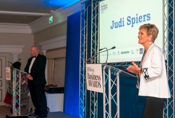 Judi Spiers on stage presenting North Devon Business Awards