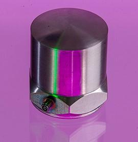 A close up shot of an A/800 accelerometer in a purple background
