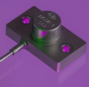 A close up shot of an A/52 accelerometer in a purple background