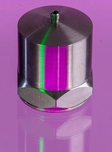 A close up shot of an A/1800 accelerometer in a purple background