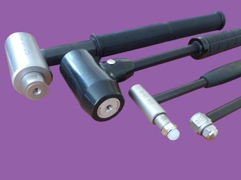 A group of Impact Hammers shot in a purple background