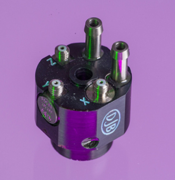 An A/133 accelerometer shot in purple background