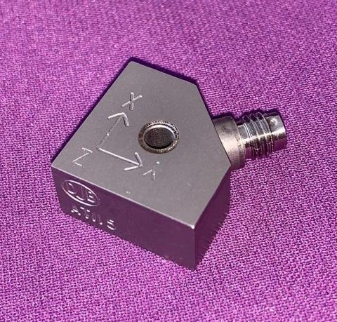 An A/15 accelerometer shot in purple background