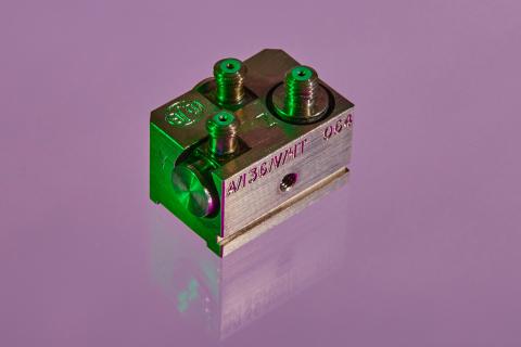 An A/136 accelerometer shot in purple background