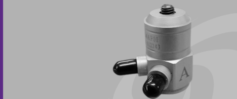 Close up shot of impedance head against grey background