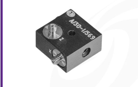 Cut-out image of DJB A/30 piezoelectric triaxial accelerometer on white background