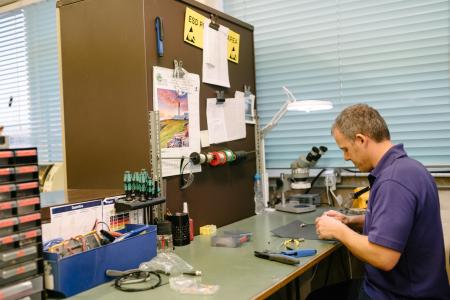 A djb employee in a workshop 