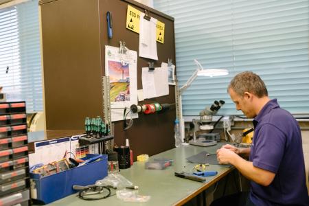 A djb employee in a workshop