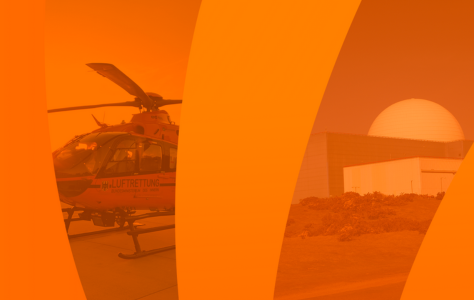 Orange background with helicopter and power station in background