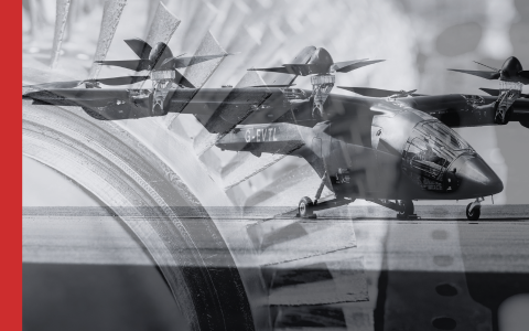 Aircraft overlaid on a close up of power station turbine in black and white