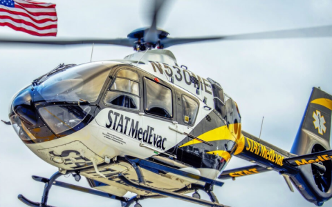 Close up of STAT MedEvac helicopter in the air