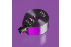 A close up shot of an A/22 accelerometer in a purple background