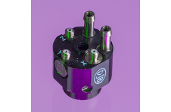 An A/133 accelerometer shot in purple background