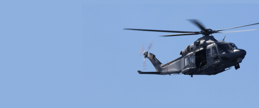 Helicopter side view against clear blue sky