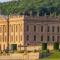 External view of Chatsworth House and grounds on a sunny day