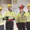 Group of engineers in hard hats and hi viz on SSE Thermal Power Station in Peterhead