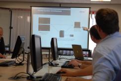 People looking at a screen during a training session