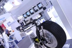 Car wheel on display at Automotive Testing Expo in Michigan