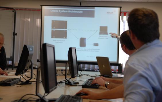 People looking at a screen during a training session