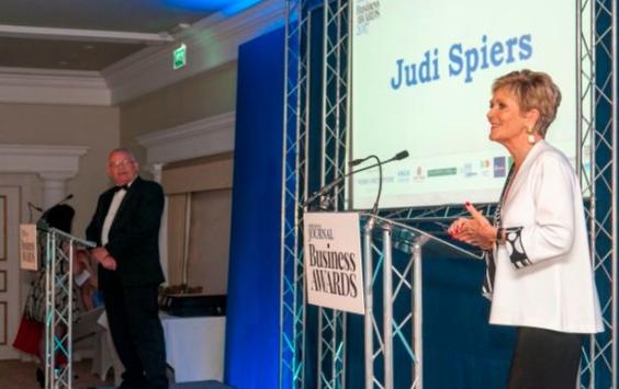 Judi Spiers on stage presenting North Devon Business Awards