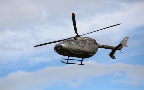 Helicopter in the air against blue sky