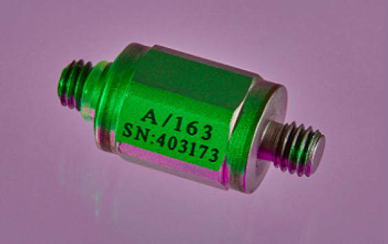 An A/163 accelerometer shot in purple background