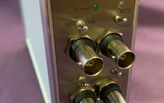 A close up shot of a 3 channel charge amplifier