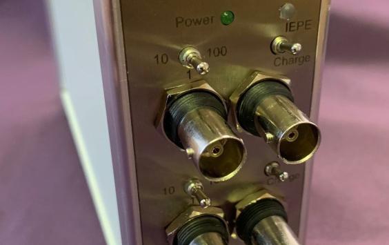 A close up shot of a 3 channel charge amplifier 