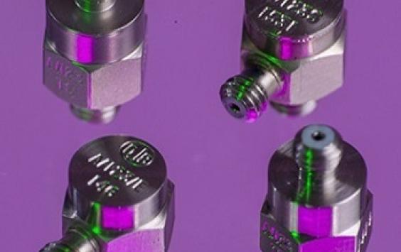 A group of A/123 accelerometers shot in a purple background