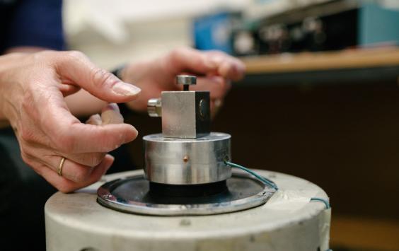 A close up shot of an accelerometer being calibrated 