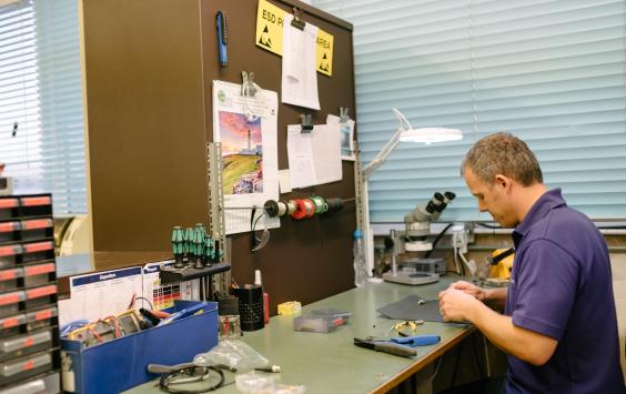 A djb employee in a workshop 