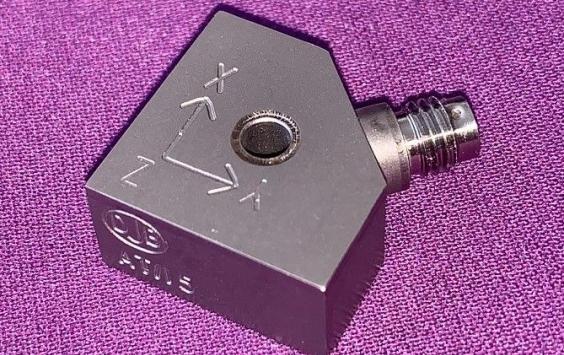 An A/15 accelerometer shot in purple background