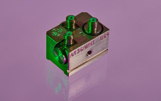 An A/136 accelerometer shot in purple background