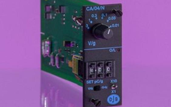 a green circuit board, charge amplifier