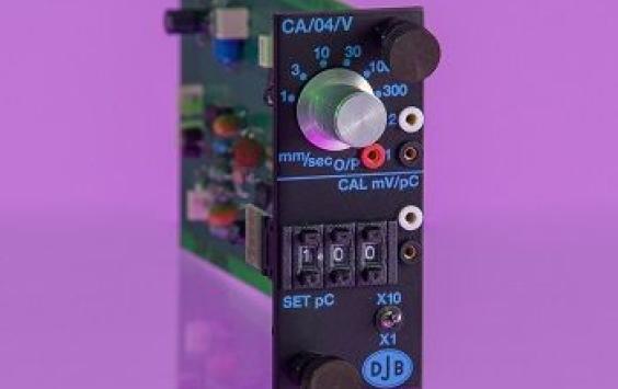 Circuit board looking green and black charge amplifier