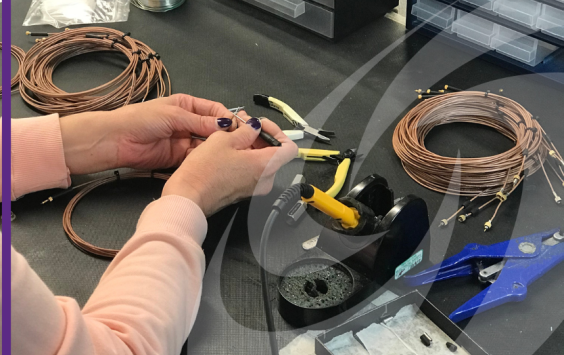 Person preparing a cable to fit a connector