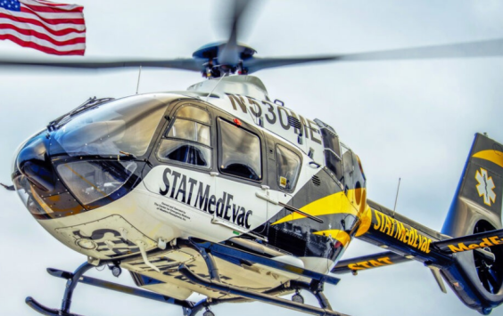Close up of STAT MedEvac helicopter in the air