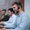 Man on phone in customer support centre